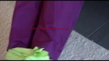 Mara tied and gagged on a sofa wearing a shiny purple rainwear combination (Video) 