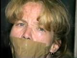 38 Yr OLD CASHIER ATTIC BOUND & GAGGED IN A BLACK LEATHER DRESS (D24-6)