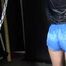 Watching sexy Sonja wearing a sexy lightblue shiny nylon shorts and a black shiny nylon rain jacket being tied and gagged overhead with cuffs, chains and a clothgag (Video)