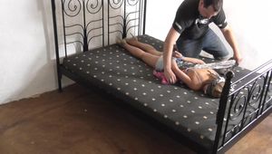 Katja im hogtie auf dem Bett 1/2