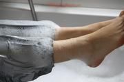 Simone in an shiny grey pvc sauna suit tied and gagged by Sophie in the bath tub (pics)