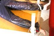 Mara tied and gagged on a bottom-up table wearing a supersexy black/red downwear combination (Pics)
