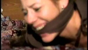 26 YEAR OLD FASHION MODEL IS MOUTH STUFFED, CLEAVE GAGGED, HOG-TIED & TOE TIED WEARING SWEATY STINKY PANTYHOSE, PLAID SKIRT & PRINT PANTIES (D67-5)