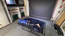 Lana tied and gagged in shiny nylon Rainwear desperately trying to free herself