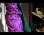 Sonja wearing a sexy purple shiny nylon rainwear combination during reordering the cupboard (Video)