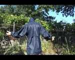 Mara wearing only a hot rain jacket and rubber boots lingering in the garden taking a shower (Video)