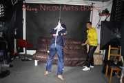Sandra beeing tied and gagged by Stella in Shiny Nylon Rainwear crotchrope-suspended 