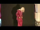 Blonde-haired archive girl posing in sexy shiny nylon rainwear (Video)