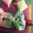 Jill tied and gagged on the floor in a green shiny nylon shorts and an green rain jacket (Video)