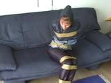 A video with one of our archive girls tied and gagged in shiny nylon rainwear
