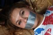 Roxana hogtied on bed