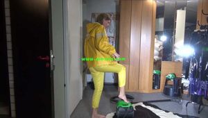 Pia wearing sexy yellow shiny nylon rainwear cleaning up the studio (Video)