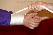 Isabelle tied and gagged in shiny nylon clothes