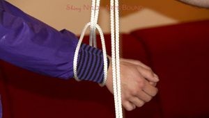 Isabelle tied and gagged in shiny nylon clothes