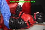 Sexy PIA wearing a sexy blue rainbib and a black/red shiny nylon rainjacket being tied, gagged and hooded on a chair with ropes and a ballgag (Pics)