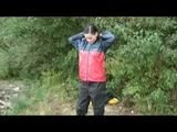 Sexy archive girl dressed with an shiny nylon adidas shorts and puts a rain pants and a rain jacket over it (Video)