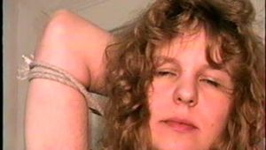 19 Yr OLD SINGLE MOM RONI IS HOME MADE RING GAGGED, HANDS TIED BEHIND HER HEAD & TIED UP SITTING BACKWARDS TO A CHAIR (D50-10)