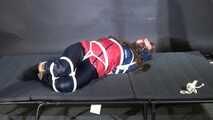 Marie bound and gagged in shiny nylon Rainwear