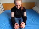 Lea wearing five very tight hose clamps on each arm
