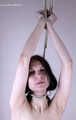 Tracy: topless barefoot girl with noose on her neck, having her to stand on her tip toes to breathe, is tickled by camera man