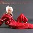 Blonde archive girl posing in a studio wearing a sexy red AGU rainwear combination (Pics)