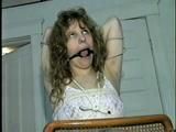 19 Yr OLD SINGLE MOM RONI IS HOME MADE RING GAGGED, HANDS TIED BEHIND HER HEAD & TIED UP SITTING BACKWARDS TO A CHAIR (D50-10)