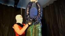 Sebastien tied by the hands in a down jacket.
