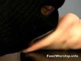 Licking her bare soles