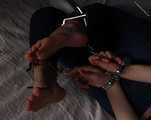 Rose hogtied on bed