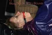 Watching sexy Pia wearing a sexy blue oldschool shiny nylon shorts and a rain jacket being tied and gagged on hands and feet on the ceiling lying on the floor (Pics)