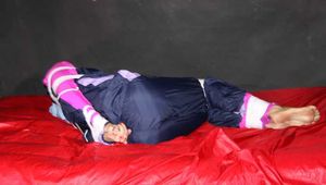 Watching Pia wearing blue/pink shiny nylon rainwear being tied and gagged and hooded with tape and a clothgag (Pics)