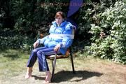 Julia tied and gagged in a shiny nylon downjacket