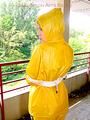 Leonie tied and gagged outdoor wearing shiny yellow rainwear (Pics)