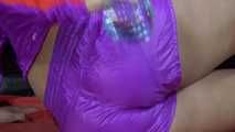 Watching Pia wearing a supersexy shiny nylon shorts and a rain jacket combination experiment with water (Video)