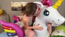 nail2pop promotional balloons on inflatable unicorn and destroying it with a pen