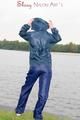 Sexy archive girl wearing a blue rain pant and rain jacket walking on a lake in freetime (Pics)