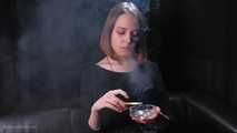 Dasha is smoking in the studio