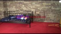 Mara tied and gagged on a princess bed in an old cellar wearing a sexy purple/blue downwear combination (Video)