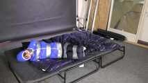 Lana tied and gagged in shiny nylon Rainwear desperately trying to free herself