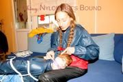 Stella tied and gagged by Leonie both wearing sexy shiny nylon rainwear (Pics)