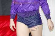Mara wearing a sexy purple shiny nylon shorts (selfmade) and a rain jacket during preparing her sofa (Pics)