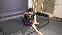 Lana handcuffed and gagged wearing a shiny nylon Windbreaker