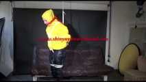 MARA tied and gagged overhead with ropes and a ballgag wearing a super sexy super shiny black rain pants, rubber boots and a yellow down jacket (Video)