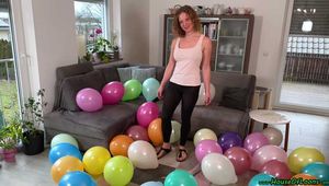 stomping 12inch balloons with Birkenstock shoe