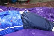 Samantha tied and gagged on bed wearing a shiny darkblue nylon rain pants and a light blue rain jacket (Pics)