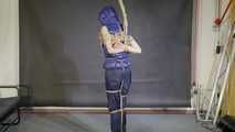 Lana bound and gagged in a shiny nylon Downvest