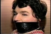 25 Yr OLD 2nd GRADE SCHOOL TEACHER IS MUMMY WRAPPED AND GAGGED WITH PLASTIC WRAP, BLACK ELECTRICAL TAPE AND SILVER DUCT TAPE ON A CHAIR (D68-13)