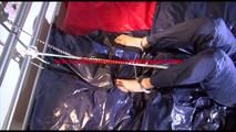 Sonja tied and gagged on bed with cuffs wearing a sexy rainwear combination (Video)
