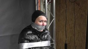 Alice taped to a Chair and tapegagged in shiny nylon Downjacket