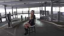 Stella on chair at car park 1/2